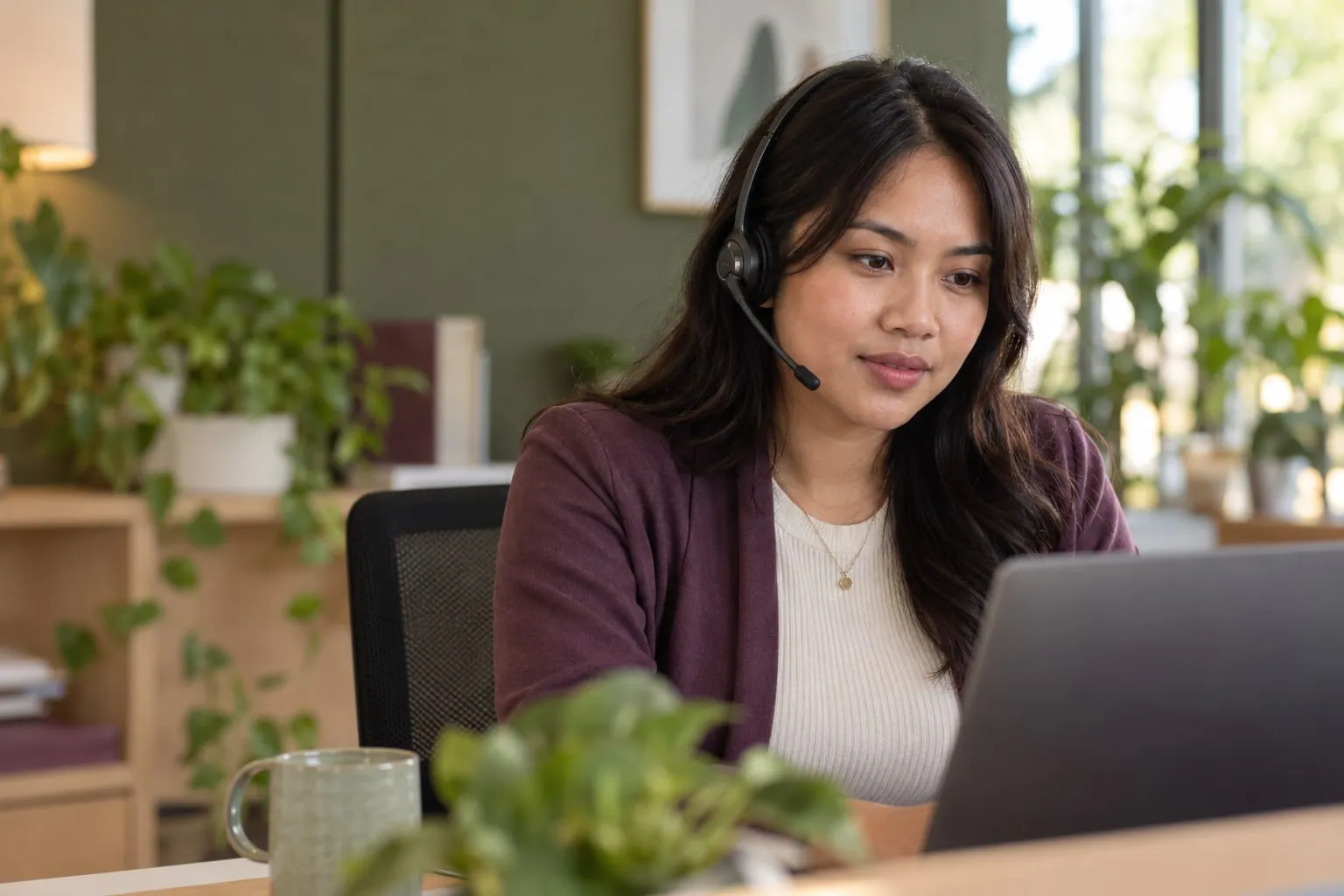 AI-generated editorial portrait of a headset-wearing support specialist at a laptop in a green office